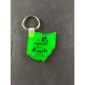It Takes A Community To Protect A Child Green Keychain